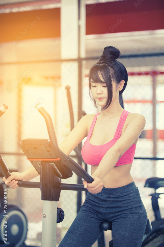 young woman exercise at the gym young woman exercise at the gym