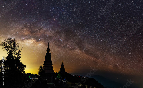 Panorama view of Milky way on top of King and Queen Pagodas at Doi Inthanon National Park, Chiang Mai, Thailand..