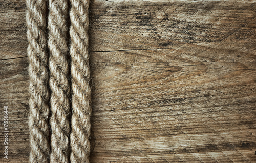 old rope on a wooden background