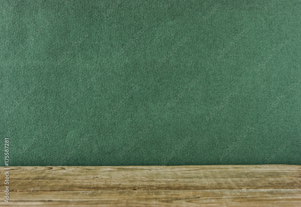 Old wooden deck table with green grunge background Old wooden deck table with green grunge background