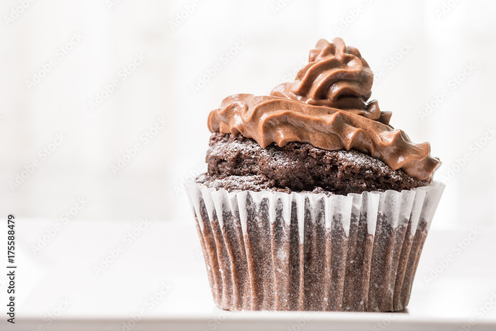 Chocolate cup cake with ganache chocolate cream with white background Chocolate cup cake with ganache chocolate cream with white background