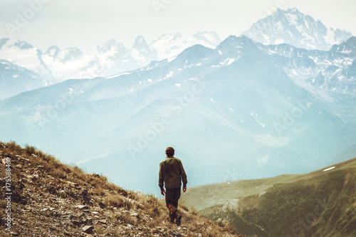 Man hiking at mountains landscape Travel Lifestyle wanderlust adventure concept summer vacations outdoor into the wild