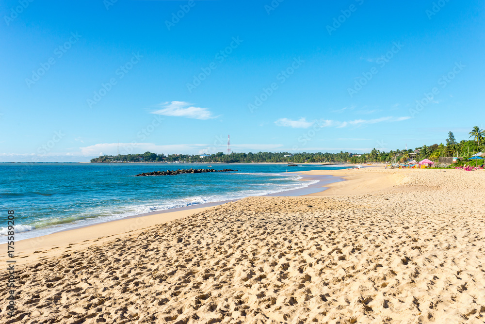 The Medaketiya beach with the powerful waves of the Indian ocean in the small town Tangalle. The coastal town has a majestic bay and the most beautiful beaches in the south and south-east