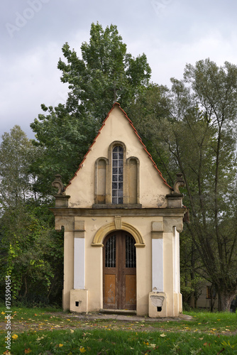 Small white chapel in the woods in Poland