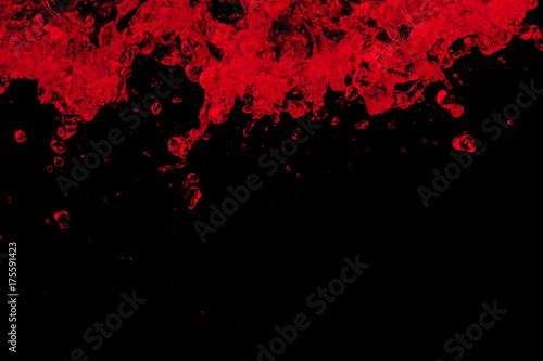 red water splash isolated on black background