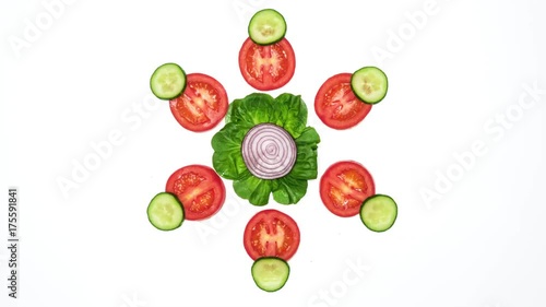 Top view on vegetable slices dancing on white background. 4k stop motion animation loop.
