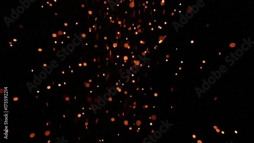 Background of slow motion of firework sparkler burning at night, out of focus
