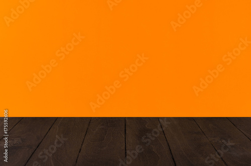 Orange  halloween background with black wooden board  perspective.