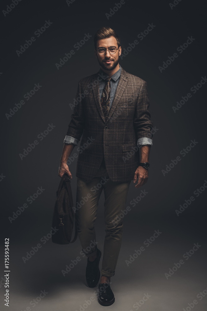 man in suit holding briefcase man in suit holding briefcase
