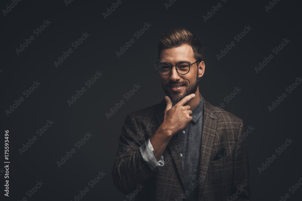 Smiling man with hand on chin Smiling man with hand on chin