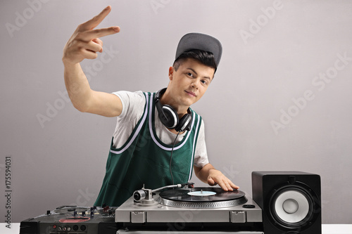 Teenage DJ making a peace sign