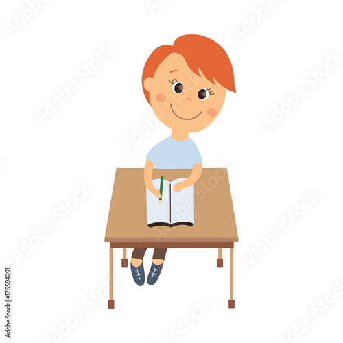 vector flat cartoon cute schoolboy character sitting at desk in elementary school smiling. Isolated illustration on a white background. Child education, back to school concept