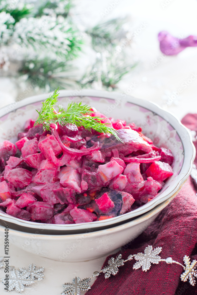 Christmas salad with beets and herring, selective focus Christmas salad with beets and herring, selective focus