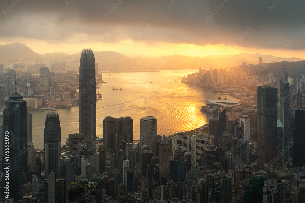 Sunrise over Hong Kong Victoria Harbor from Victoria Peak with Hong Kong and Kowloon below.