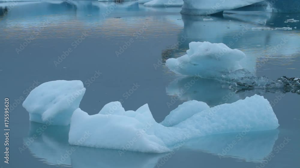 Moving iceberg in Jokulsarlon glacier lake in Iceland Moving iceberg in Jokulsarlon glacier lake in Iceland