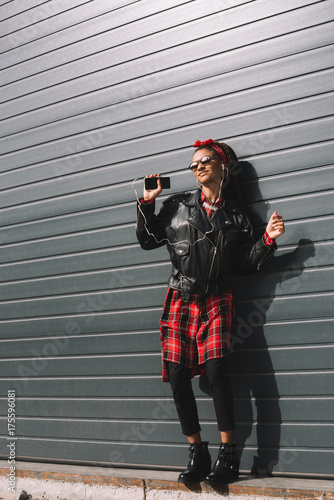 stylish african american girl with smartphone photo