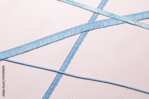 Blue ribbon on paper background