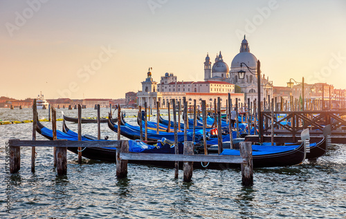 Gondolas on Grand Canal in Venice Italy sunset view Cathedral