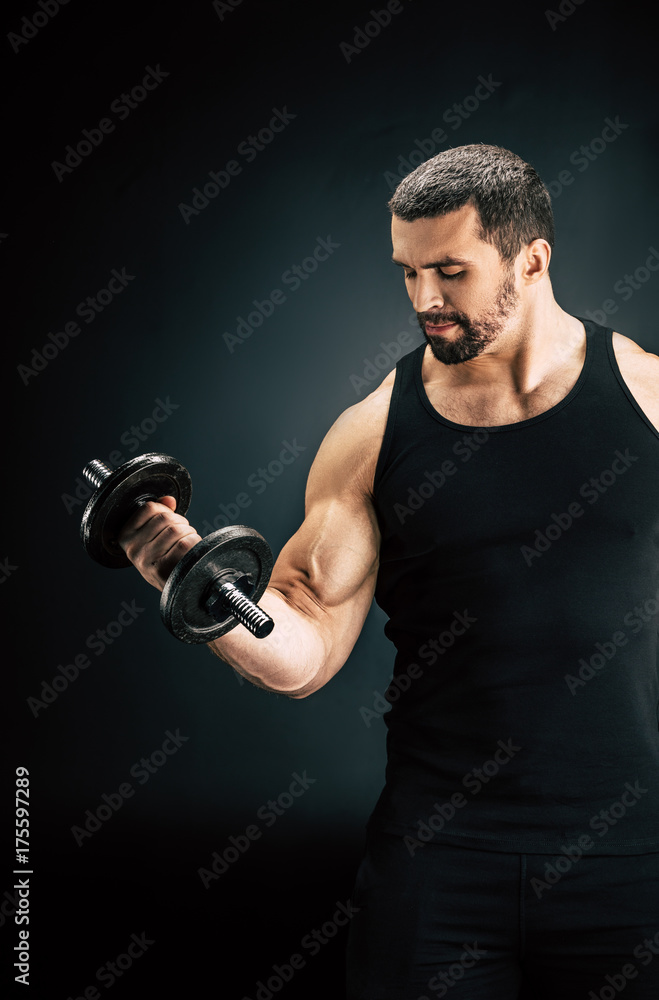sportive man pumping muscles