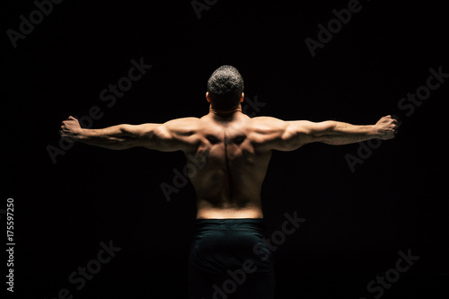 shirtless sportive man showing muscles