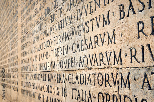 Iscrizione latina sul muro esterno dell'Ara Pacis di Augusto a Roma photo
