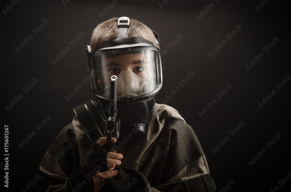 the photo of a boy in a gas mask on grey background Stock Photo | Adobe  Stock