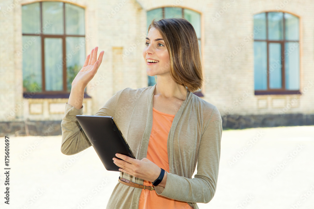 Hello. Young beautiful woman with digital tablet in hands. Hello. Young beautiful woman with digital tablet in hands.