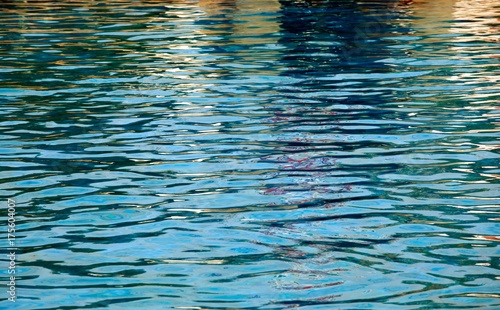Blue pool water background . Clean and bright water in swimming pool.