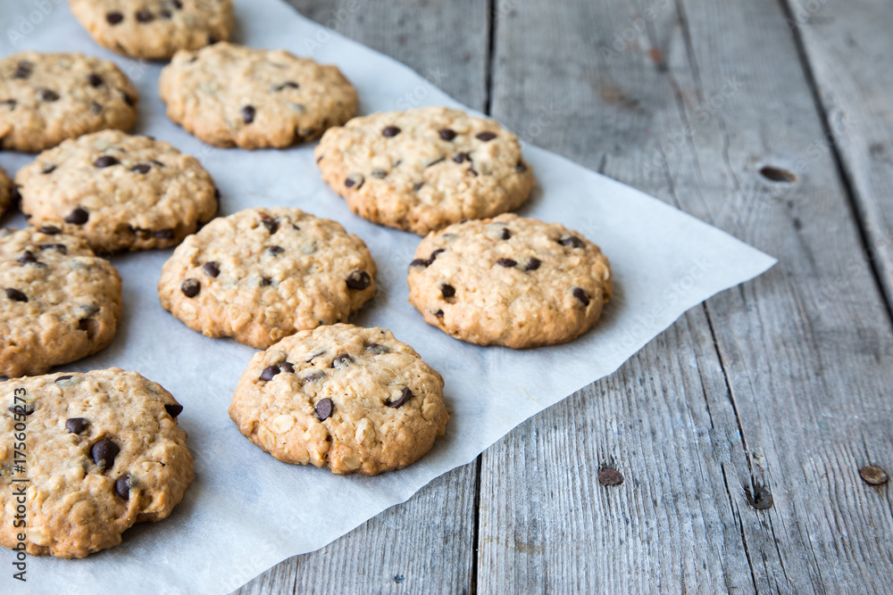oatmeal cookies with chocolate on an old wooden background oatmeal cookies with chocolate on an old wooden background