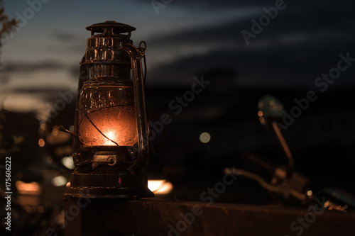 Retro lantern (Thai lightlamp) with orange hot flame with twilight sky