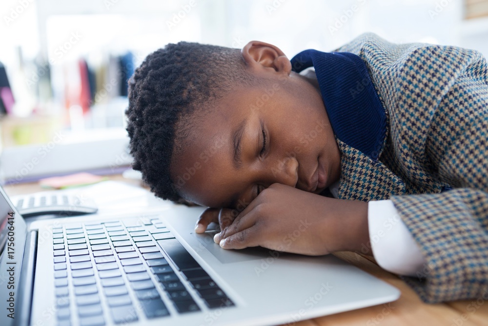 Businessman taking a nap on laptop Businessman taking a nap on laptop