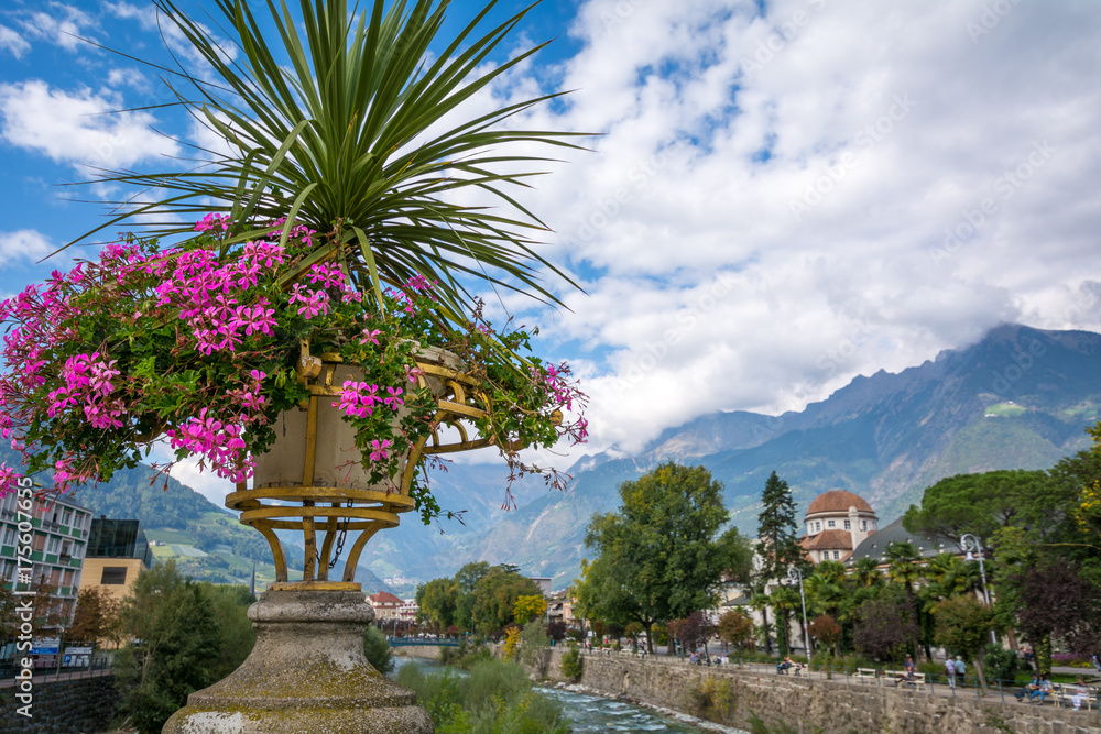 Merano in South Tyrol, a beautiful city of Trentino Alto Adige, View on the famous promenade along the Passirio river. Italy.