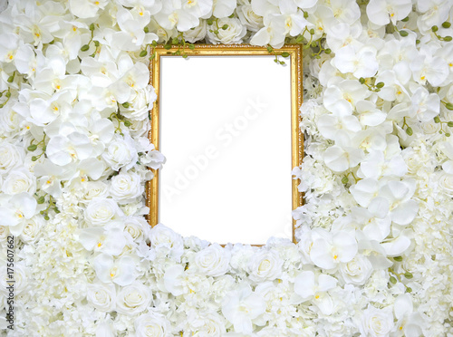 Golden vintage frame with decoration artificial white rose and orchid flower as floral background or copy space with clipping path.Flat lay of old picture frame for valentines day or wedding ceremony.