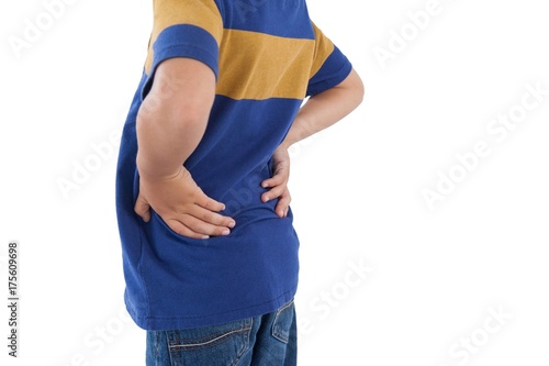 Mid-section of boy having an back pain