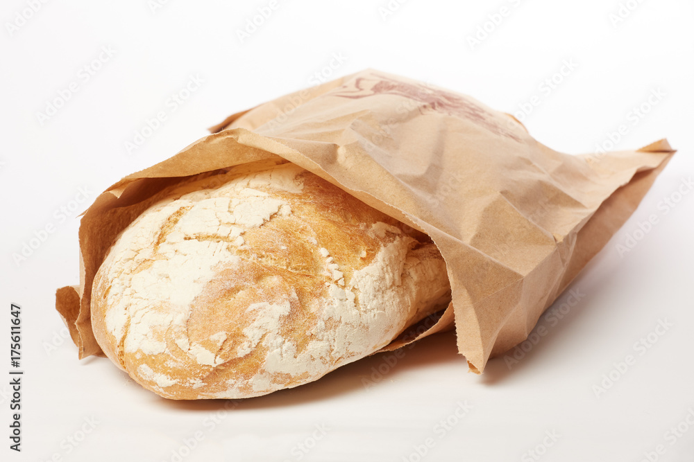 Bread in a paper bag isolated on white