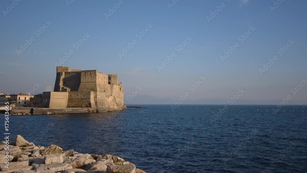 Ancient Castel dell'Ovo and Tyrrhenian sea in amazing evening in Naples, Italy Ancient Castel dell'Ovo and Tyrrhenian sea in amazing evening in Naples, Italy