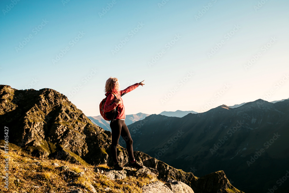 Young woman on the top in the mountains Young woman on the top in the mountains