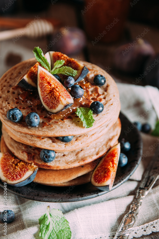 Delicious breakfast. Homemade pancakes with fresh figs and bluberries Delicious breakfast. Homemade pancakes with fresh figs and bluberries