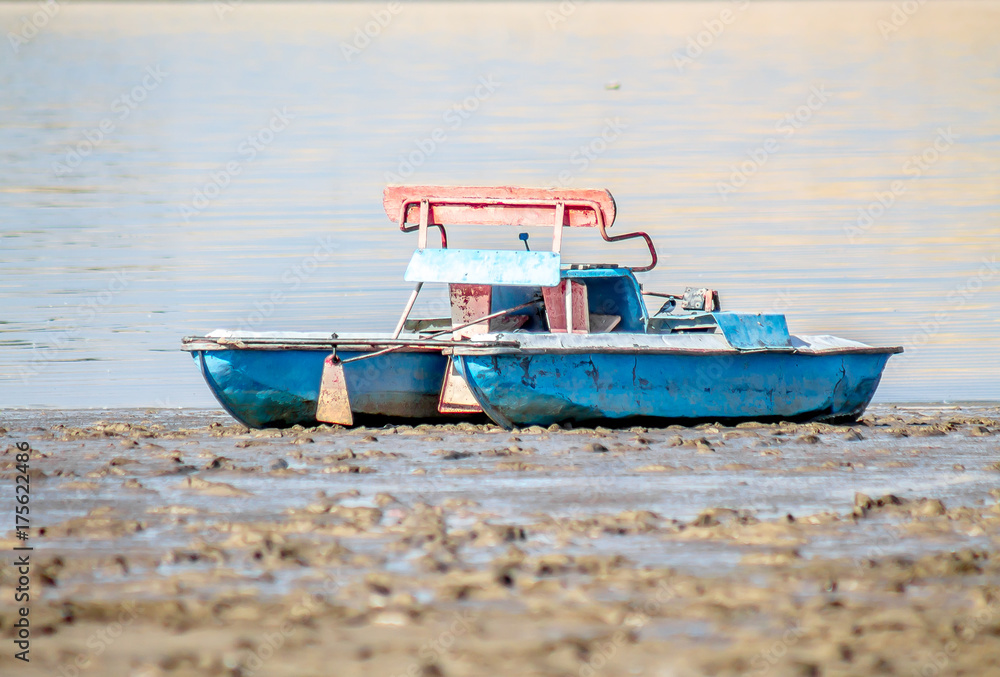Naklejka premium Old catamaran on the beach