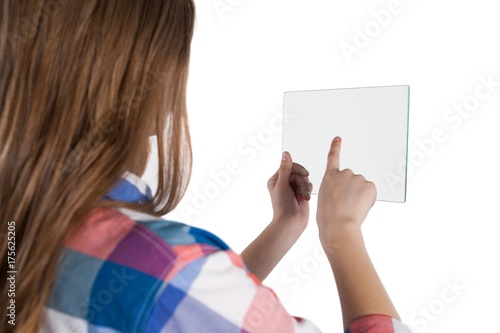 Fototapeta Naklejka Na Ścianę i Meble -  Girl using a glass digital tablet against white background