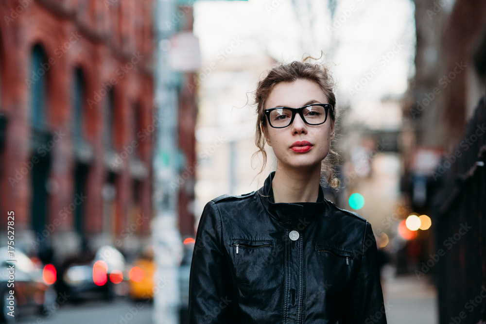 Portrait of serious young woman in the street Portrait of serious young woman in the street