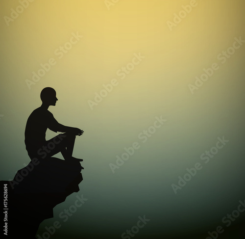 man sits on the rock look at the empty space of the break, meditation man silhouette