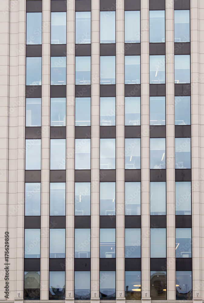 Building full of windows. Full frame of building. Building full of windows. Full frame of building.