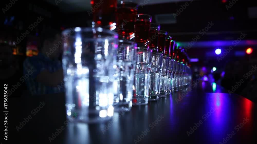 Bar, club, close-up, cocktails in a row, blurred background Bar, club, close-up, cocktails in a row, blurred background