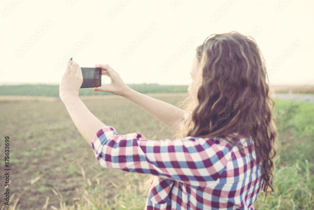 Beautiful young woman selfie in nature