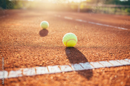 Tennis ball on tennis court © yossarian6