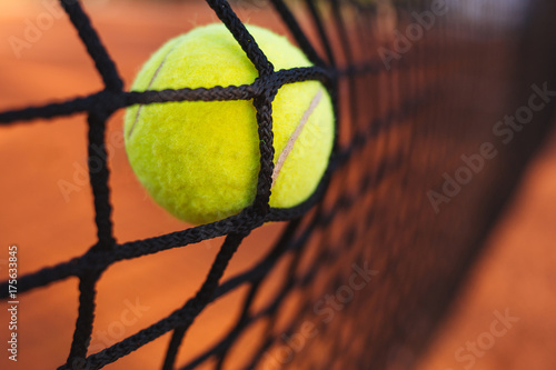 Tennis ball in tennis net © yossarian6