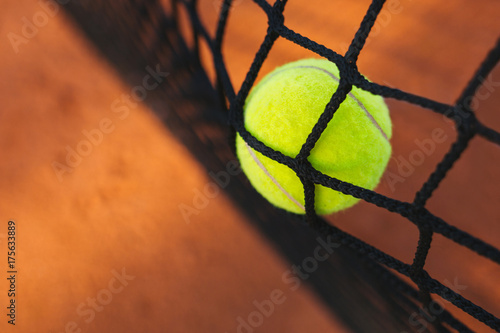 Tennis ball hitting the tennis net © yossarian6