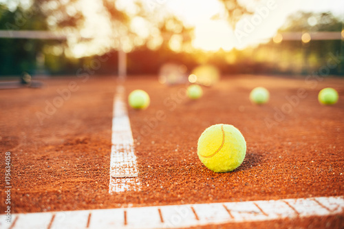 Tennis balls on clay court © yossarian6