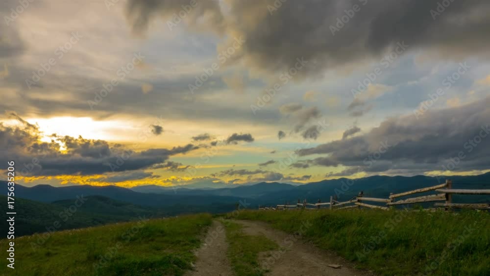 Dramatic Sunset Sky in the Mountains with a Dirt Road in the Foreground and Clouds in the Background. Timelapse. 4K.
Dramatic Sunset Sky in the Mountains with a Dirt Road in the Foreground and Clouds in the Background. Timelapse. 4K.